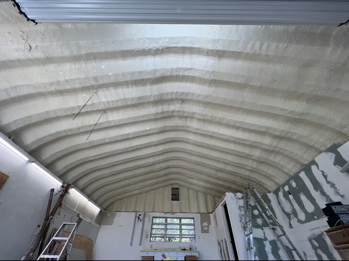 Spray polyurethane foam applied to the underside of a metal roof deck in Stayton